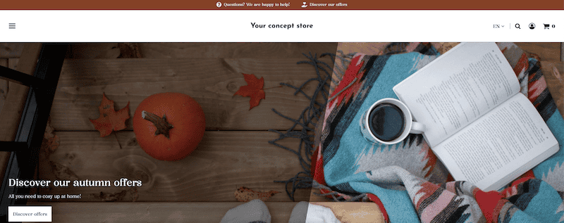 Banner image depicting an autumnal atmosphere: someone is standing in socks on a wooden floor, on which there is a Hokkaido pumpkin, some autumn leaves and a colourful blanket with a coffee mug and a book on top. On the left-hand side of the image is a dark overlay with white lettering and the following headline: "Discover our autumn offers". Text: "All you need to cosy up at home!" Button: "Discover offers".