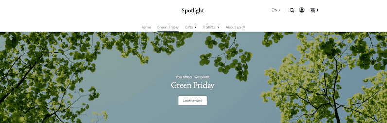 Large image at the top of the website with the caption: "You shop – we plant. Green Friday." and a "Learn more" button. The image shows a view up into the treetops, which frame a blue sky.